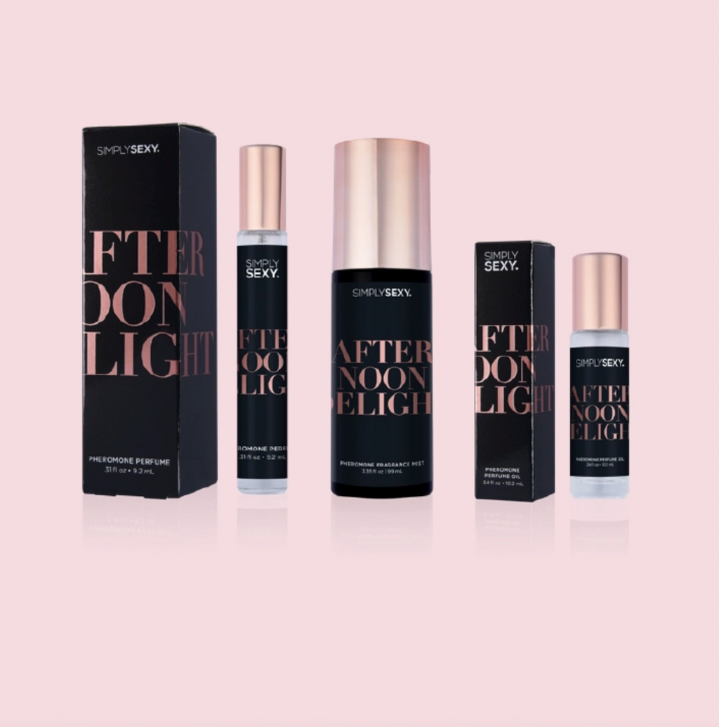 Perfume bottles and packaging of 'Afternoon Light' on a pink background