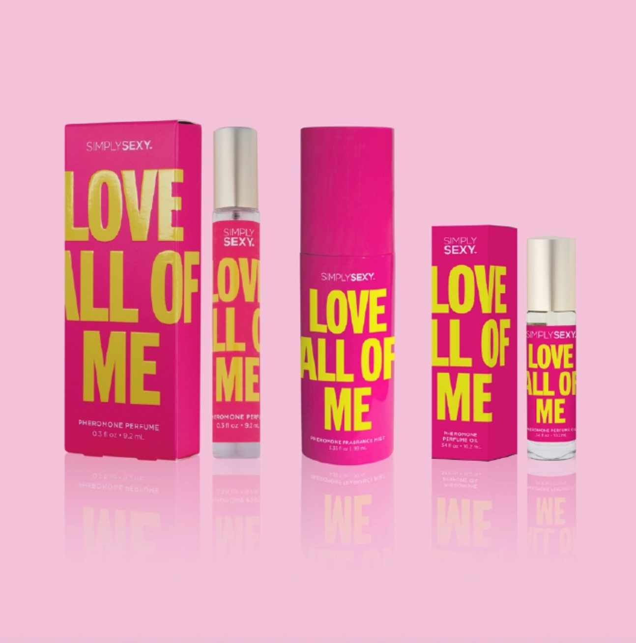 Pink and yellow 'Love All of Me' perfume bottles and packaging on a pink background