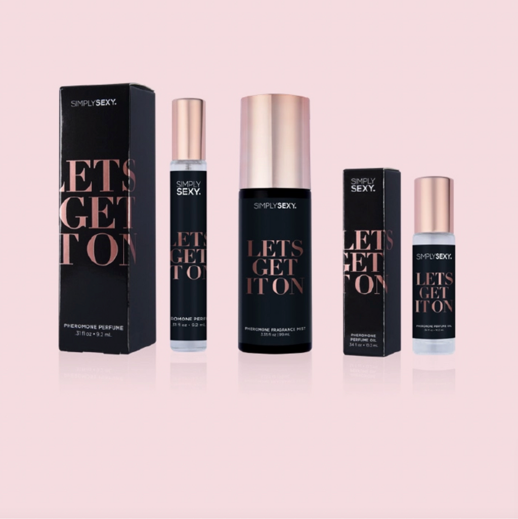 Perfume bottles and packaging with 'Simply Sexy' branding on a light pink background