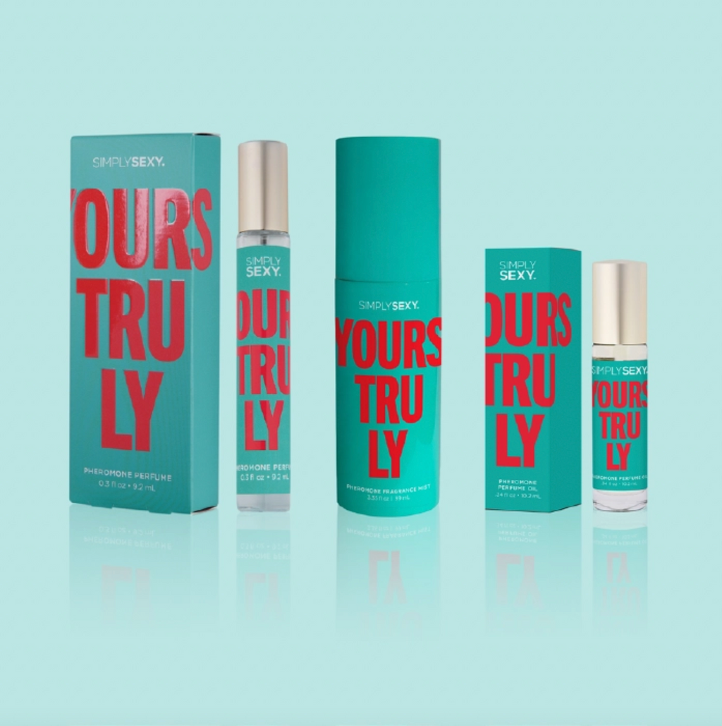 Perfume bottles and packaging with 'Ours Truly' text on a light blue background